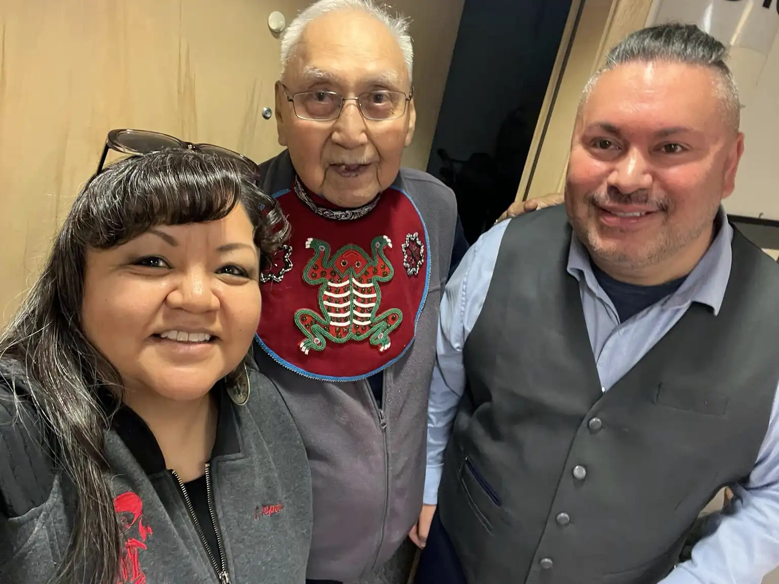 Full size image of Ray Wilson wearing recreated bib utilizing repatriated frog crest. Also in image is Jerrick Hope-Lang and unknown.